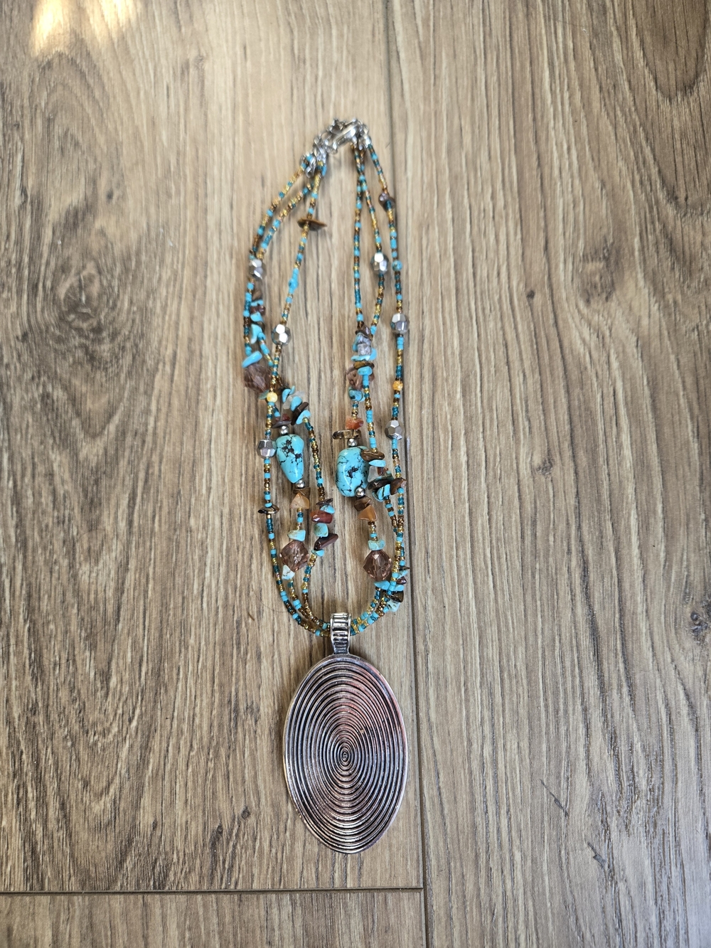 Multi-Strand Beaded Necklace with Oval Pendant